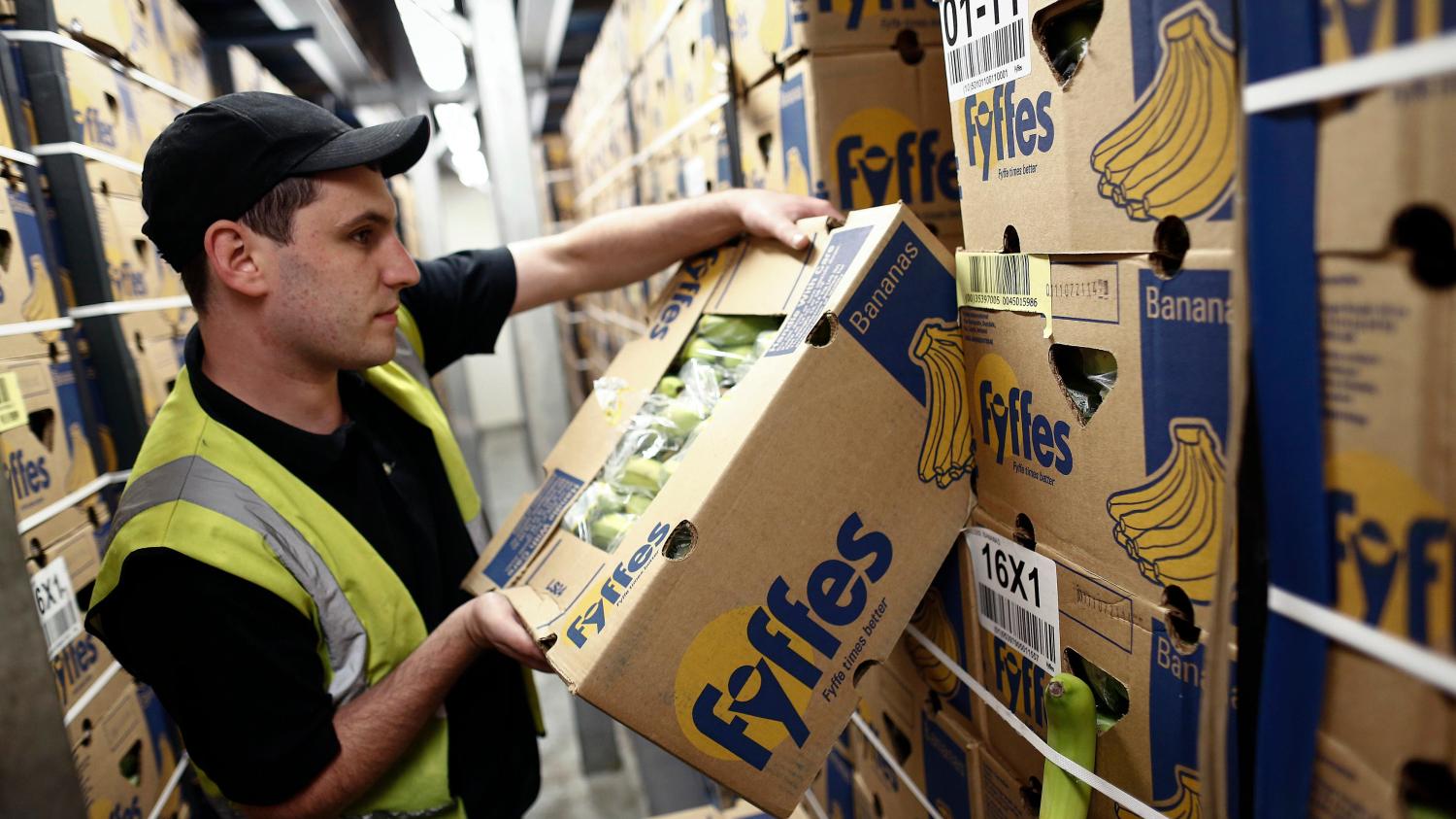 Fyffes Bananas box being packed by worker